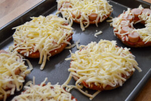 Bagel pizzas on a baking tray